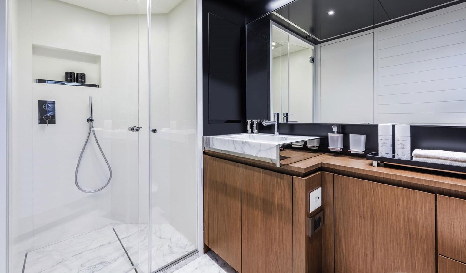 a kitchen with black cabinets aboard UNDISCLOSED Yacht for Sale