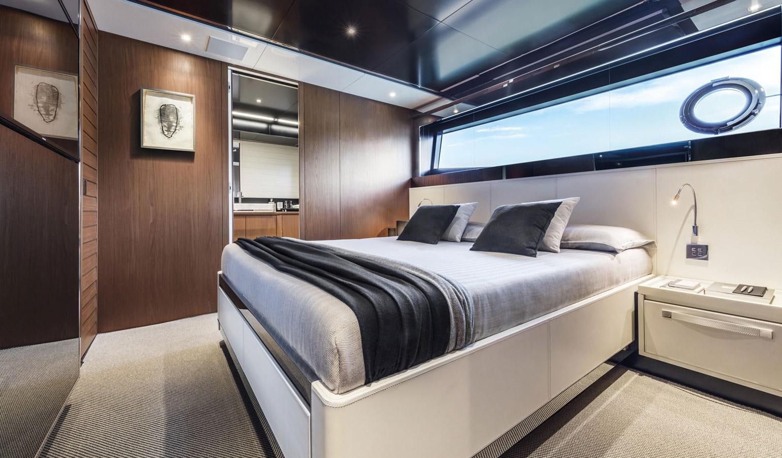 a room with a bed and a desk aboard UNDISCLOSED Yacht for Sale