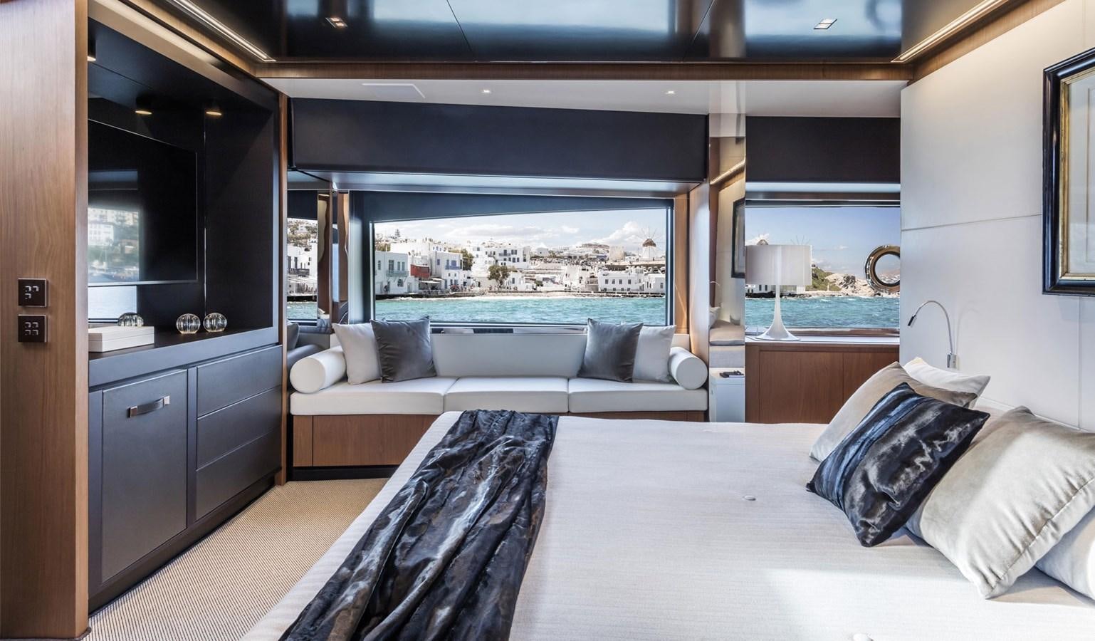 a room with a bed and a window aboard UNDISCLOSED Yacht for Sale