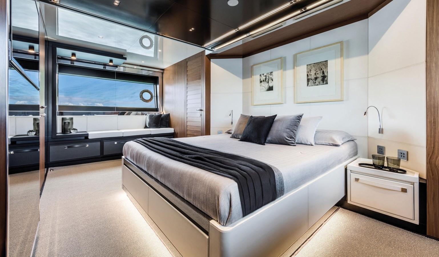 a room with a bed and a desk aboard UNDISCLOSED Yacht for Sale