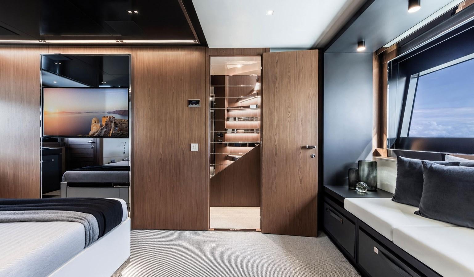 a room with a bed and a closet aboard UNDISCLOSED Yacht for Sale