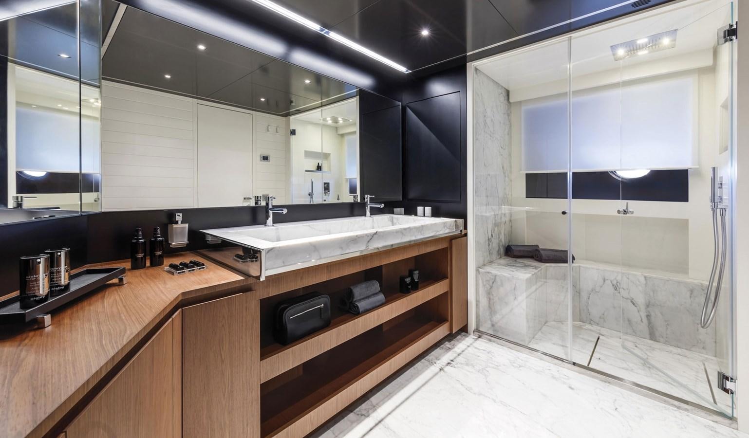 a bathroom with a large mirror aboard UNDISCLOSED Yacht for Sale