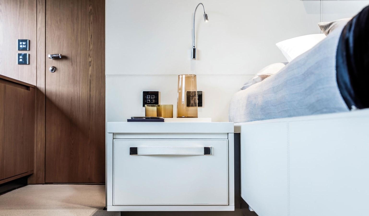 a room with a bed and a desk aboard UNDISCLOSED Yacht for Sale