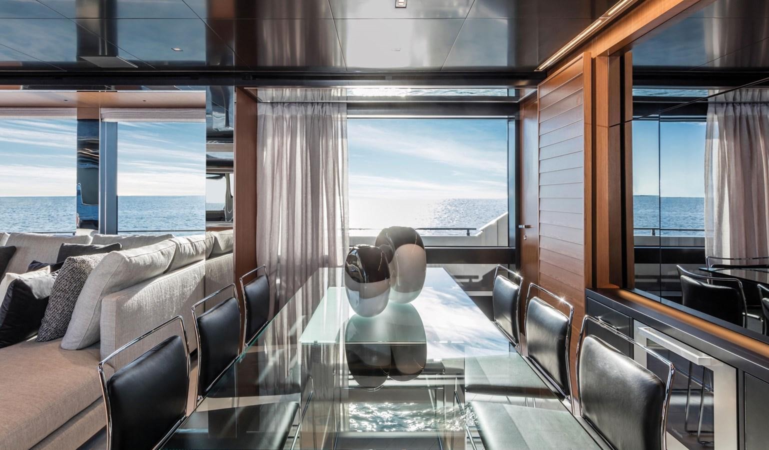 a room with a table and chairs aboard UNDISCLOSED Yacht for Sale
