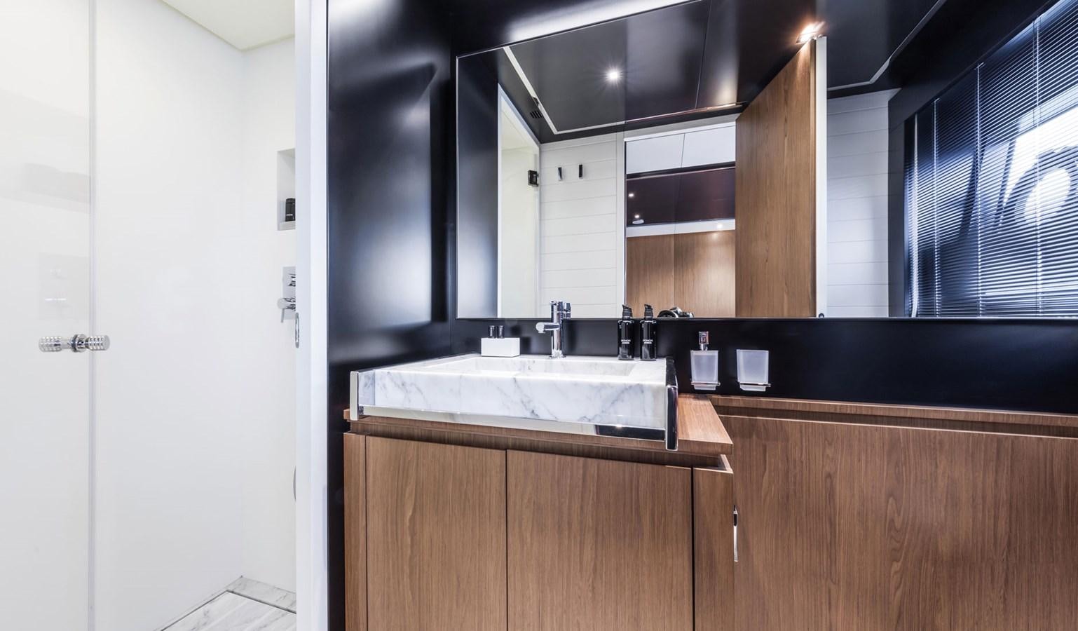 a kitchen with black cabinets aboard UNDISCLOSED Yacht for Sale