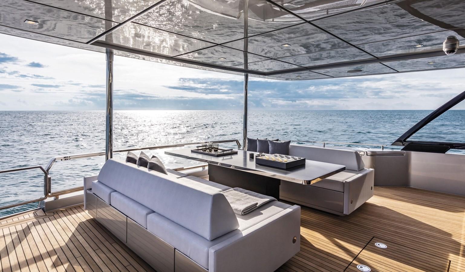 a room with a bed and a table on a deck aboard UNDISCLOSED Yacht for Sale