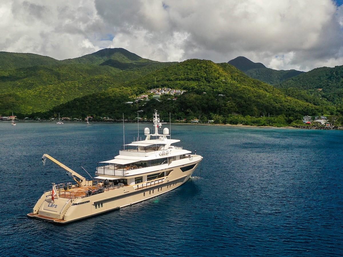 a large ship in the water aboard AMIKA Yacht for Sale