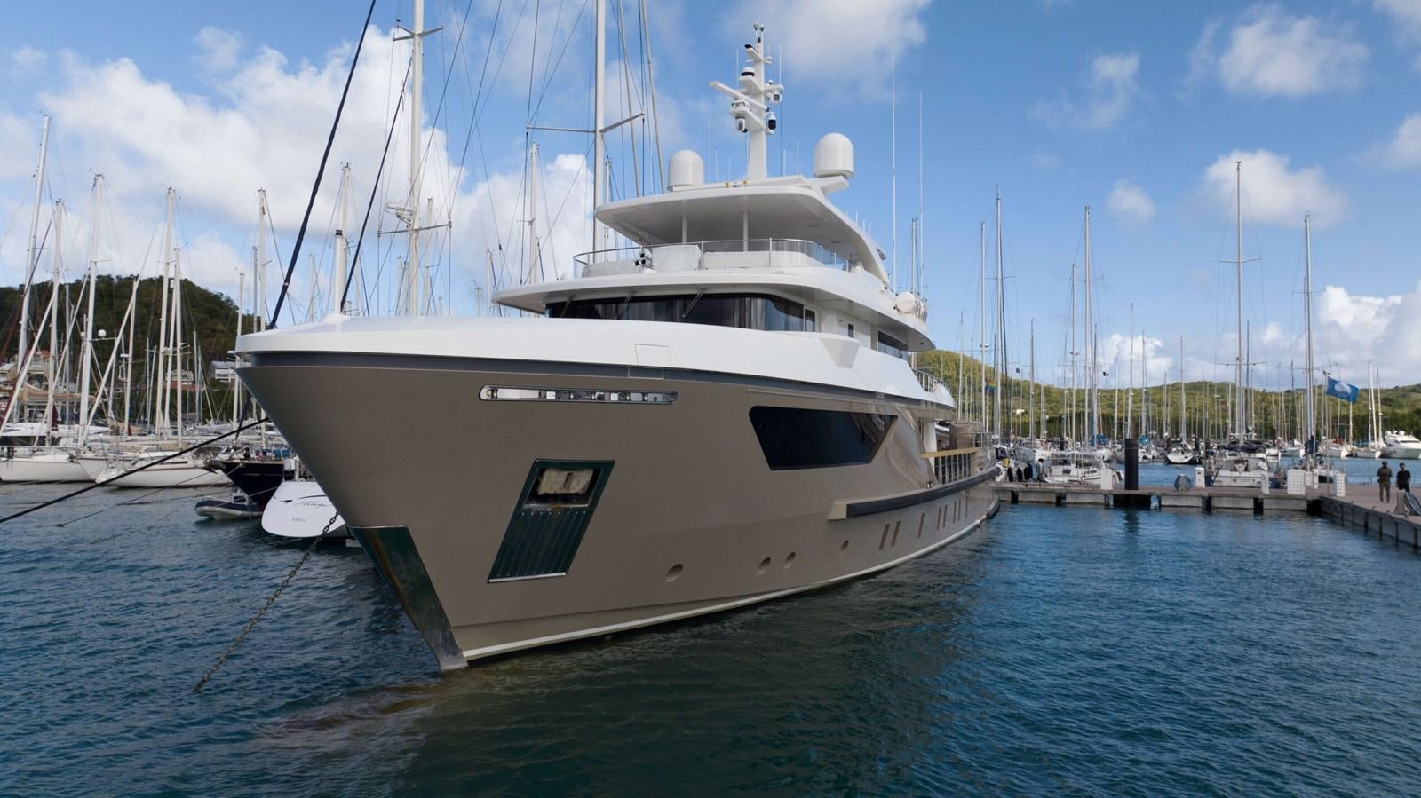a white boat in the water aboard AMIKA Yacht for Sale