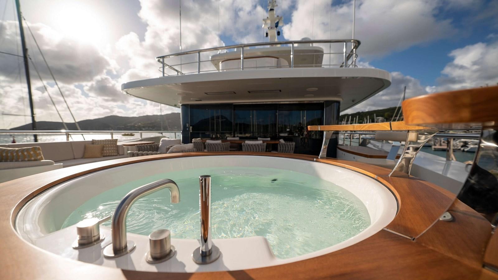 a large swimming pool aboard AMIKA Yacht for Sale