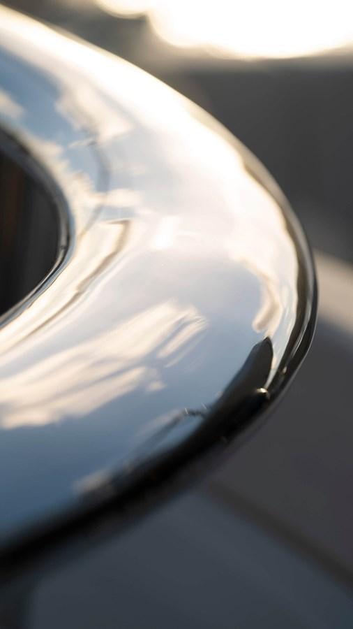 a close-up of a steering wheel aboard AMIKA Yacht for Sale