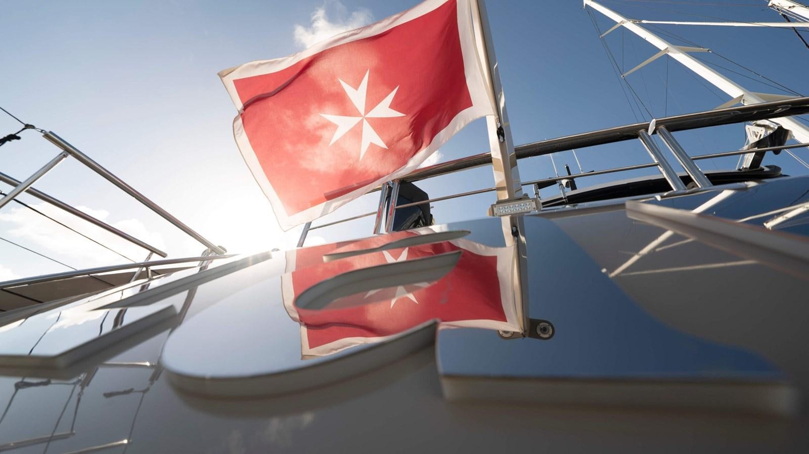 a flag on a boat aboard AMIKA Yacht for Sale