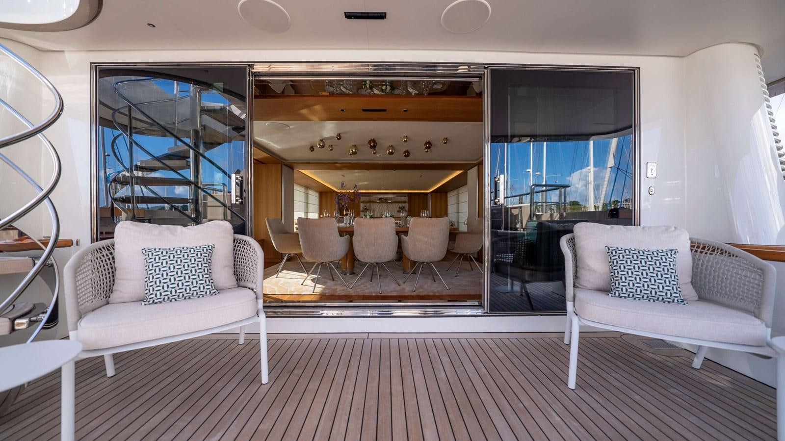 a living room with a large open window aboard AMIKA Yacht for Sale