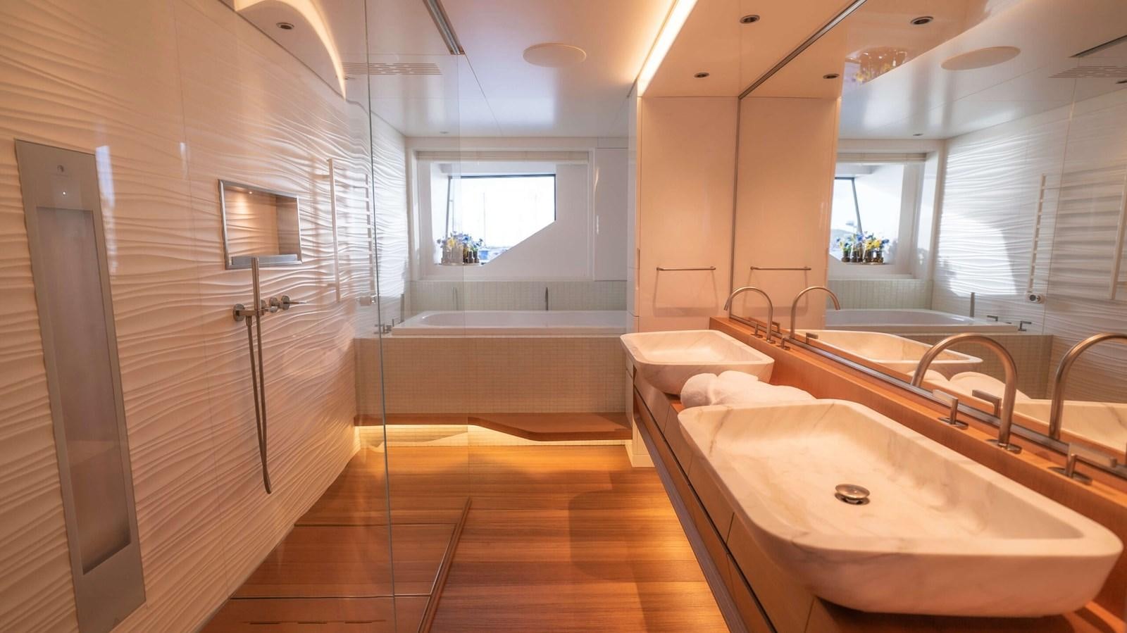 a bathroom with a large tub aboard AMIKA Yacht for Sale