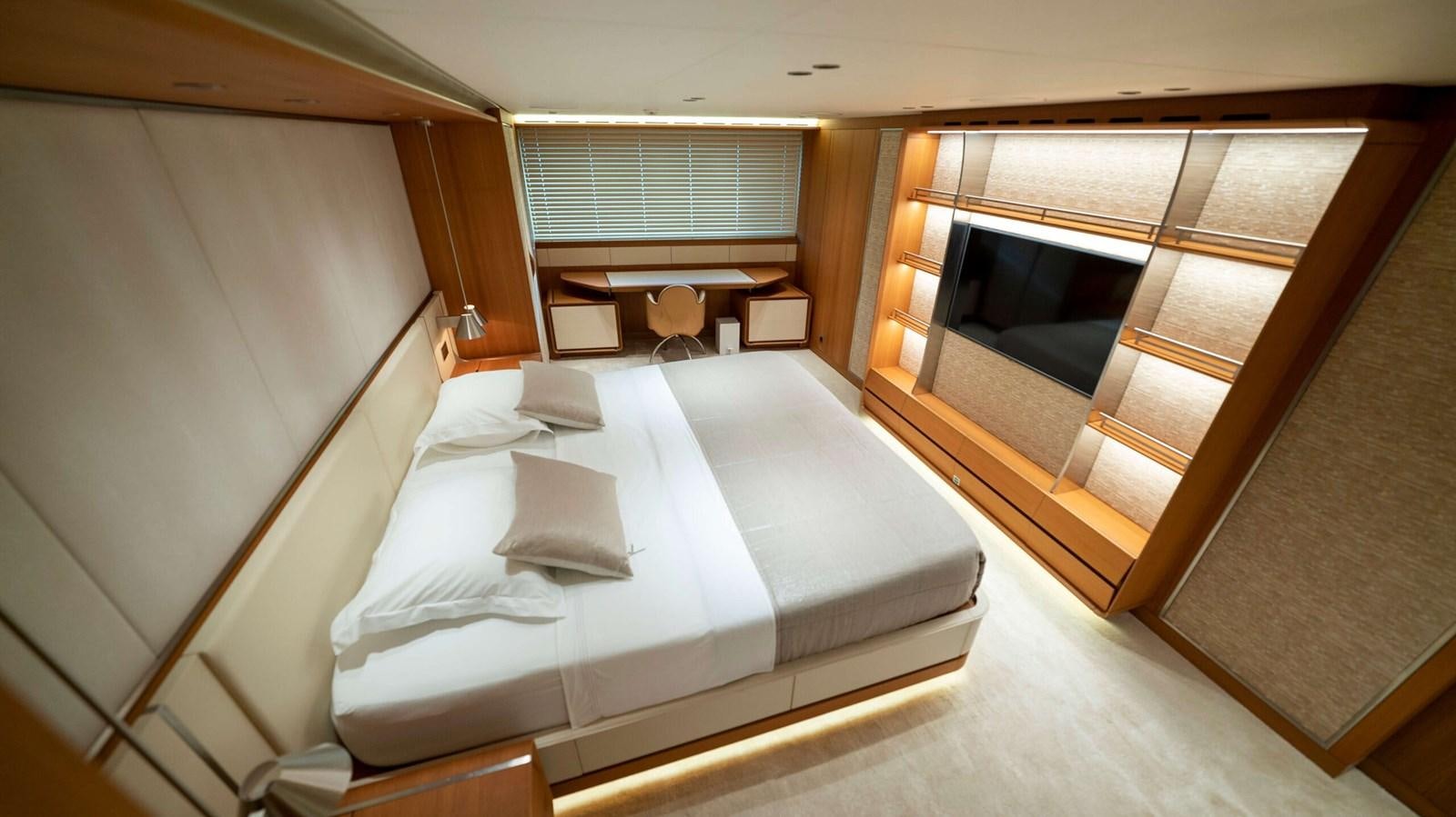 a room with a bed and a window aboard AMIKA Yacht for Sale