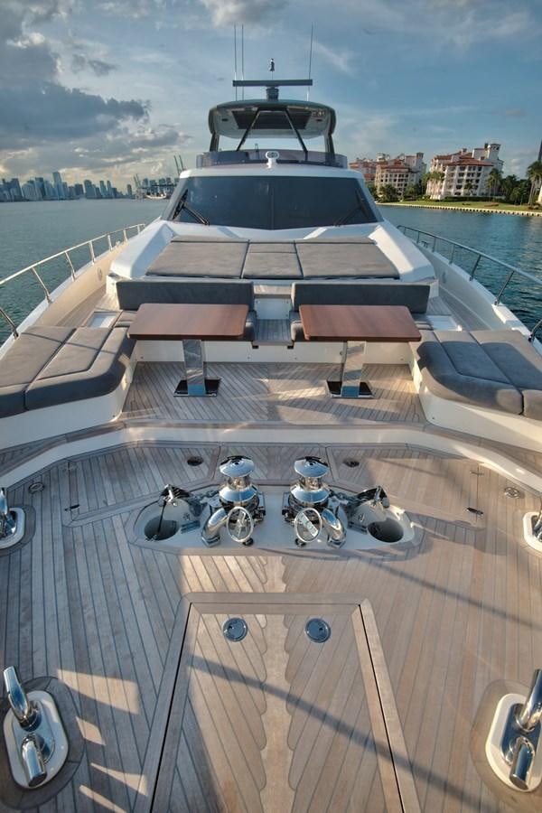 a boat with a motorbike on it aboard CIAO II Yacht for Sale