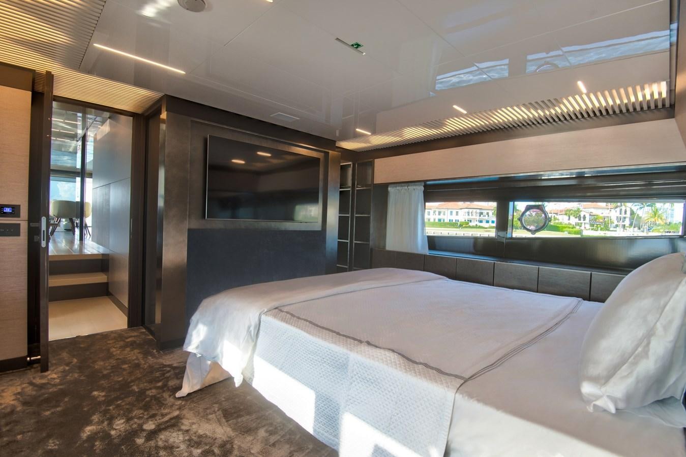 a room with a bed and a window aboard CIAO II Yacht for Sale