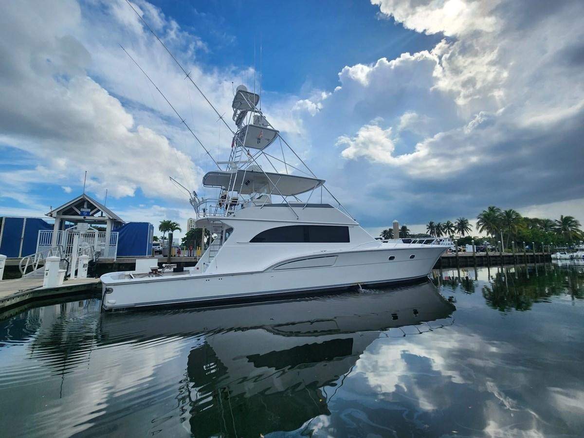 a white boat docked at a pier aboard CENTURY STAR Yacht for Sale
