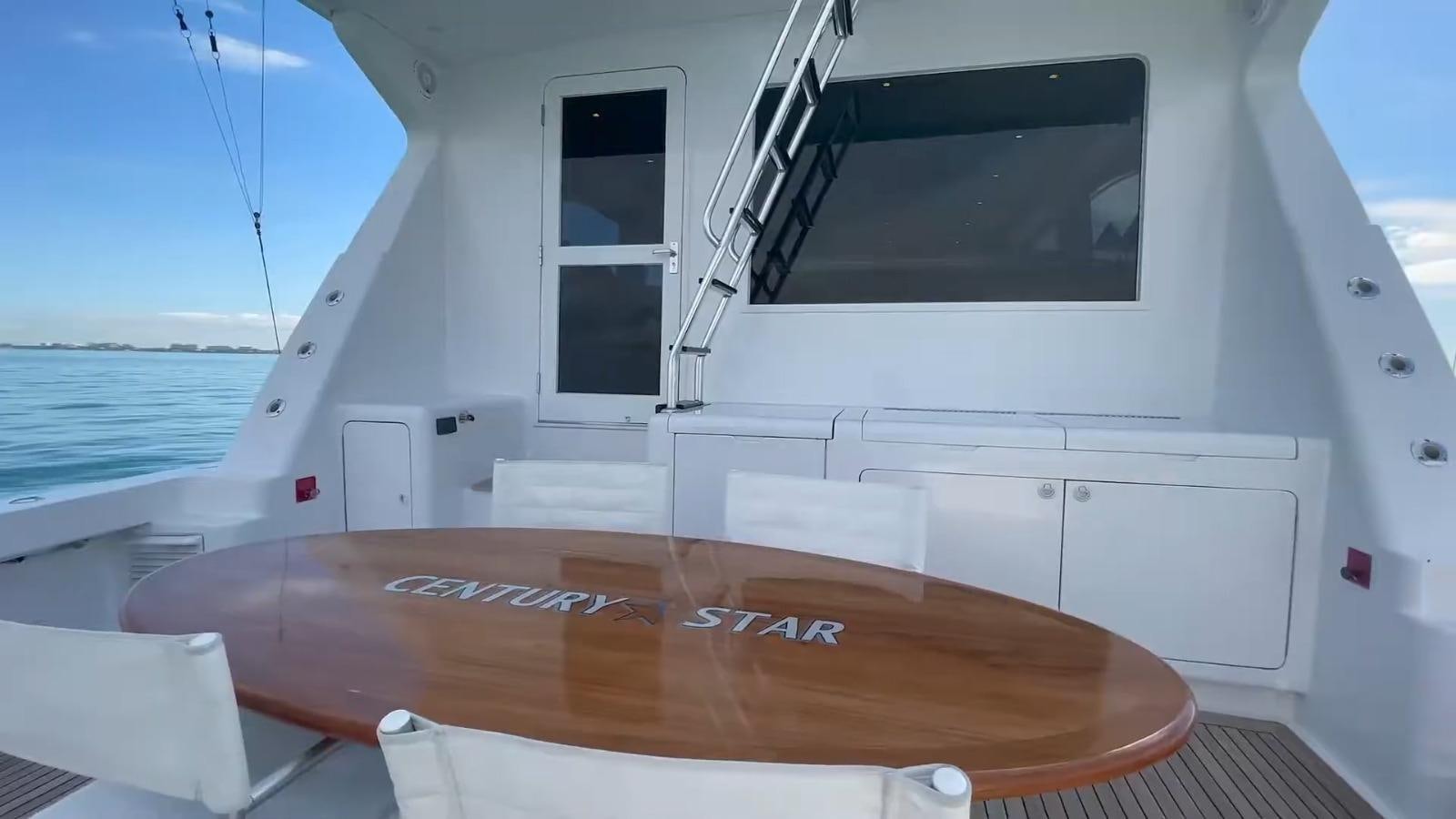 a table on a boat aboard CENTURY STAR Yacht for Sale