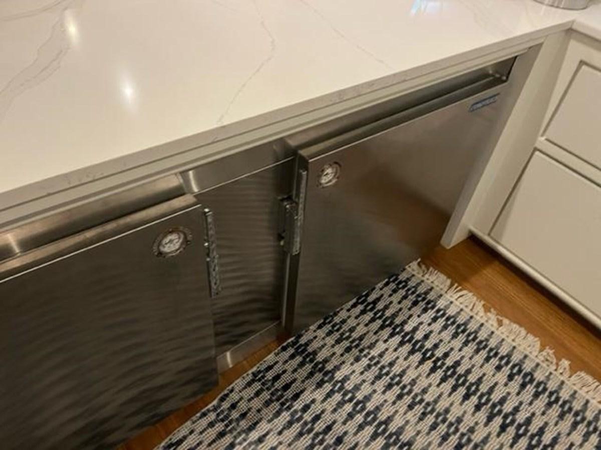 a kitchen with a black counter aboard CENTURY STAR Yacht for Sale