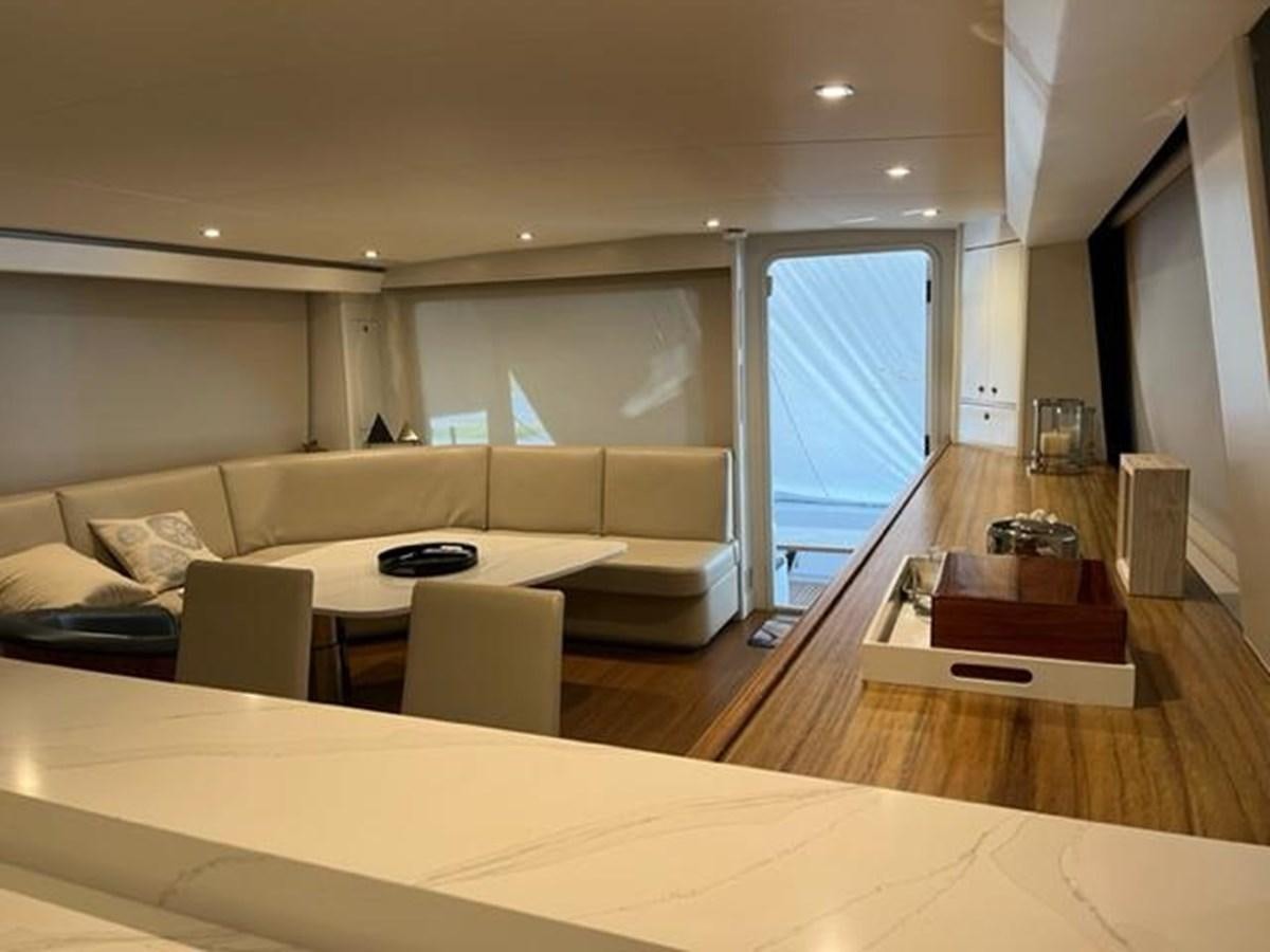 a living room with a couch and a table aboard CENTURY STAR Yacht for Sale