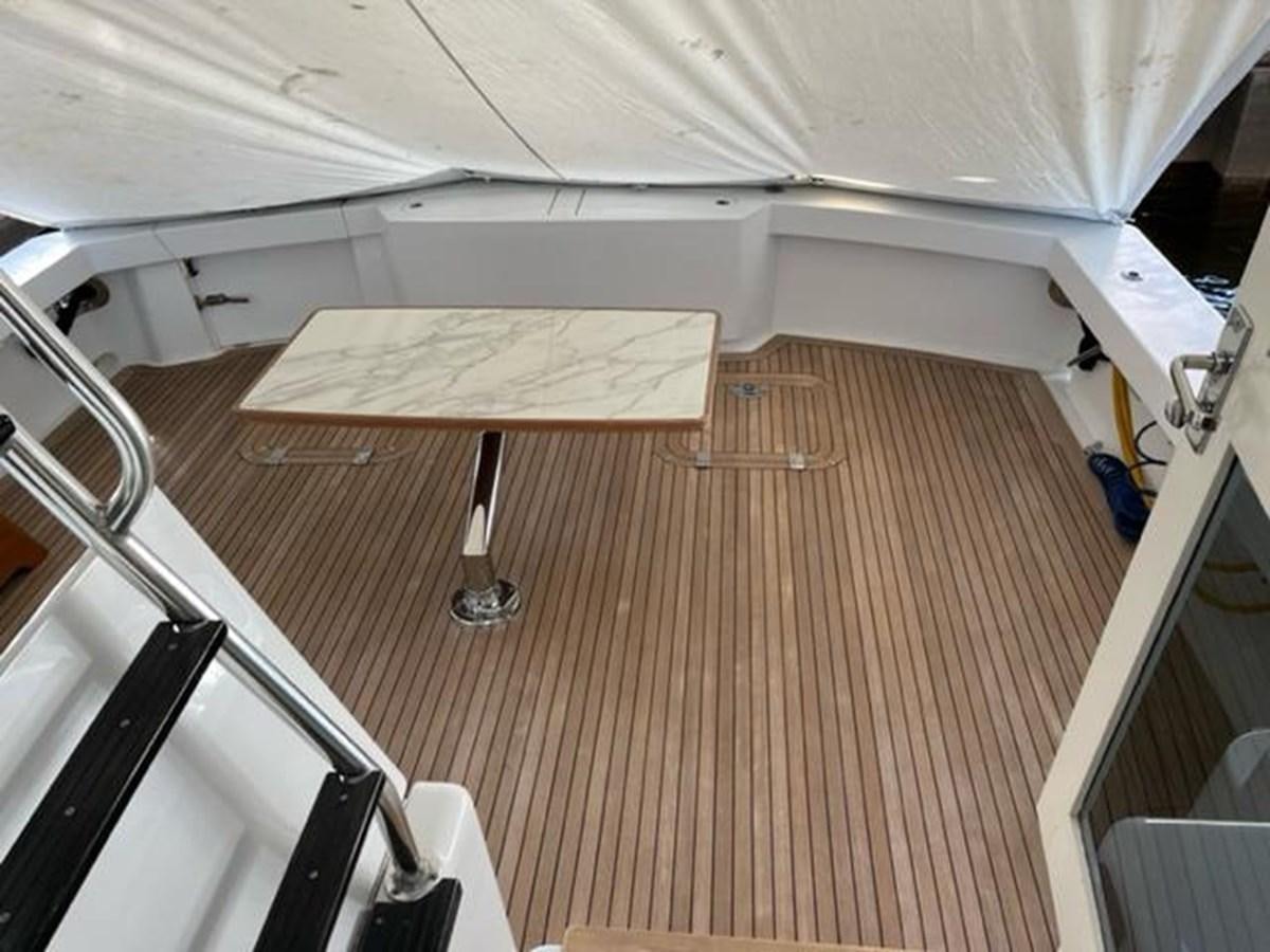 a room with a table and chairs aboard CENTURY STAR Yacht for Sale
