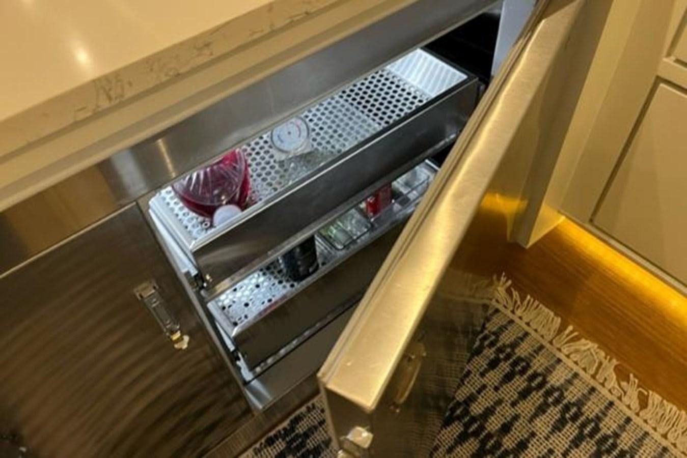 a glass cabinet with a clear door aboard CENTURY STAR Yacht for Sale