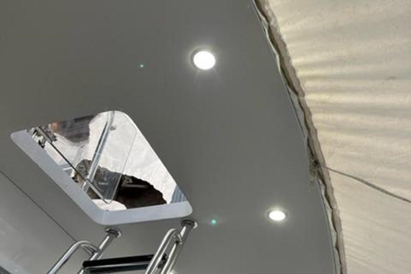 a white boat with a black sail aboard CENTURY STAR Yacht for Sale