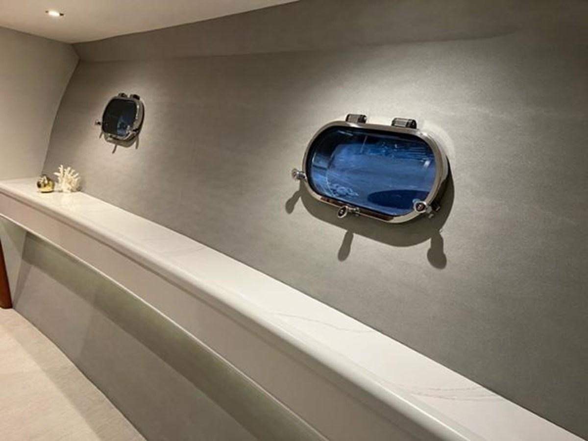 a couple of sunglasses on a white table aboard CENTURY STAR Yacht for Sale