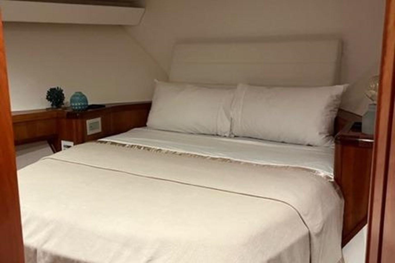a bed with white sheets aboard CENTURY STAR Yacht for Sale