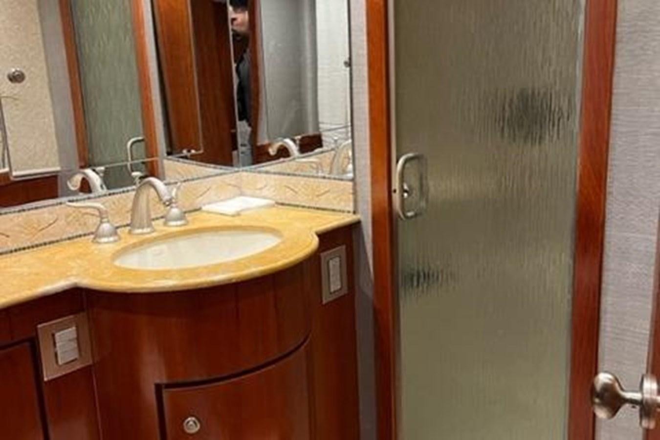 a bathroom sink with a mirror aboard CENTURY STAR Yacht for Sale