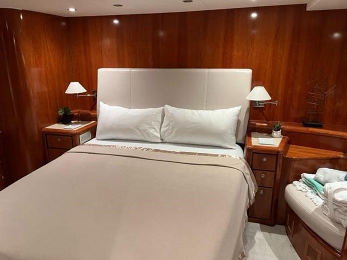 a bed with white sheets aboard CENTURY STAR Yacht for Sale