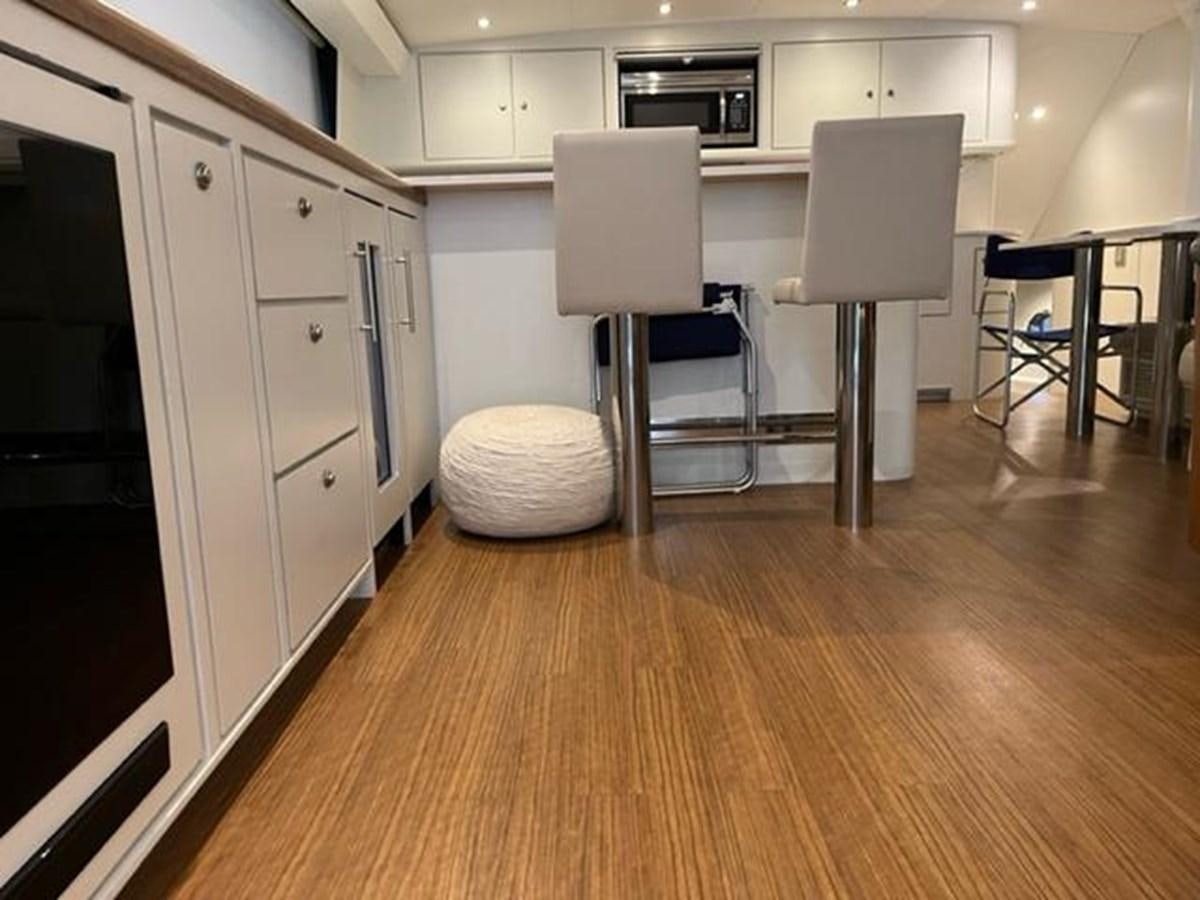 a room with a chair and a table and chairs aboard CENTURY STAR Yacht for Sale