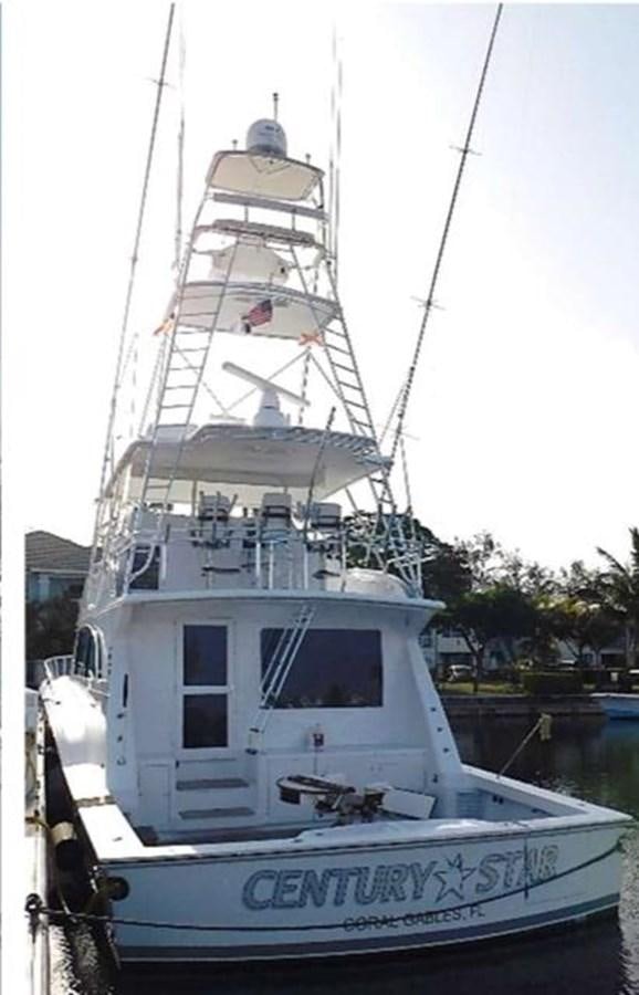 a white boat in the water aboard CENTURY STAR Yacht for Sale