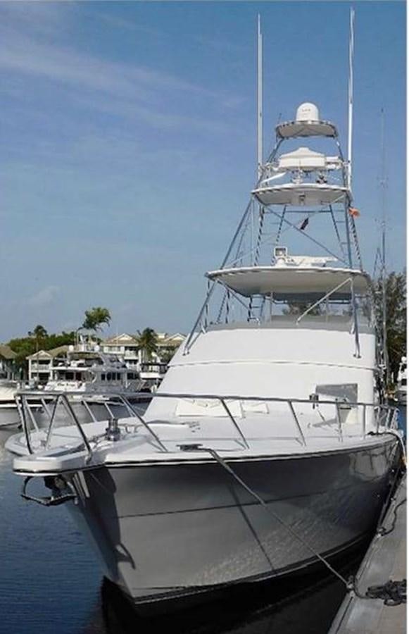 a white boat in a harbor aboard CENTURY STAR Yacht for Sale