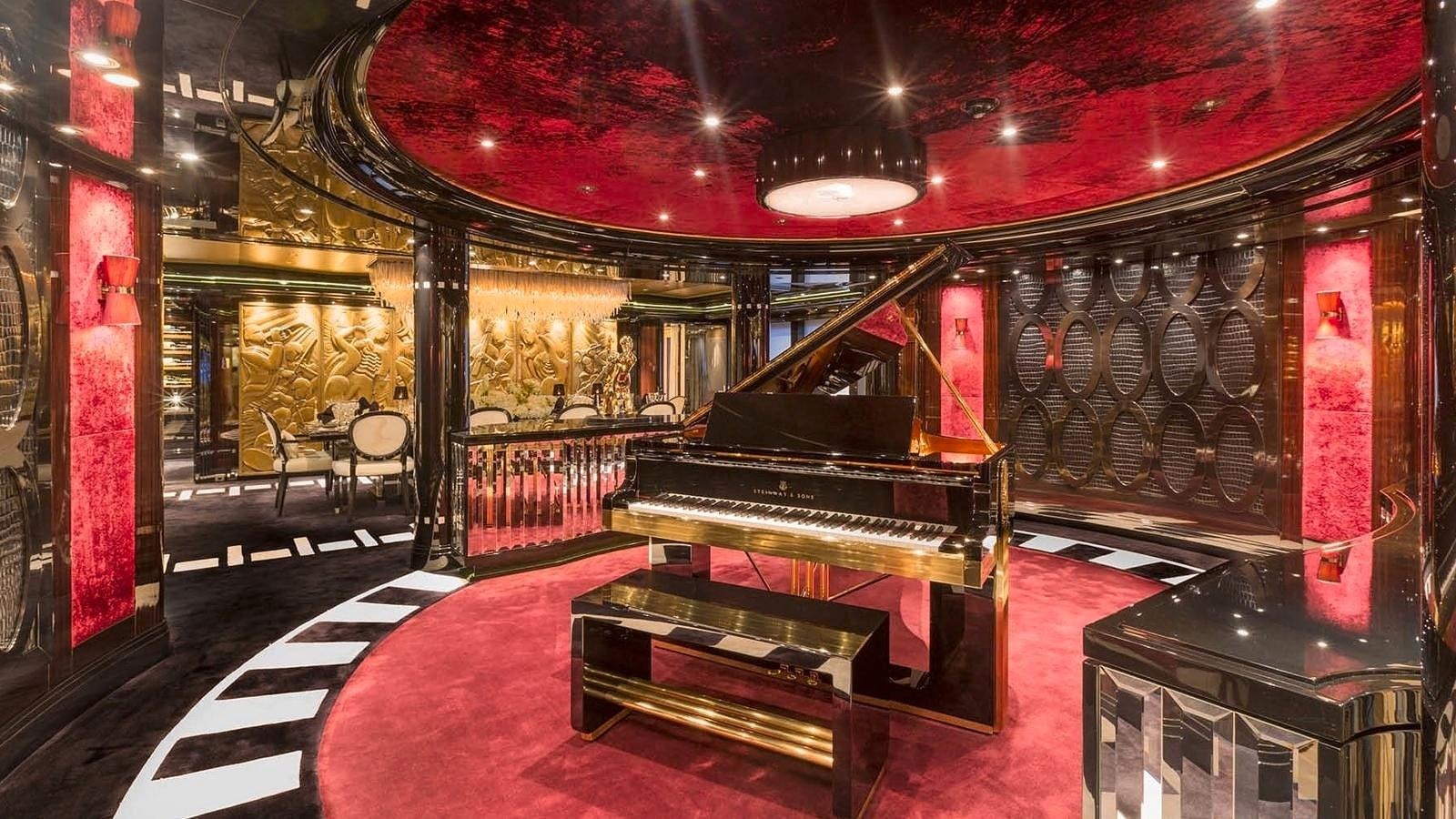 a room with a red carpet and a black and white rug aboard PHOENIX 2 Yacht for Sale