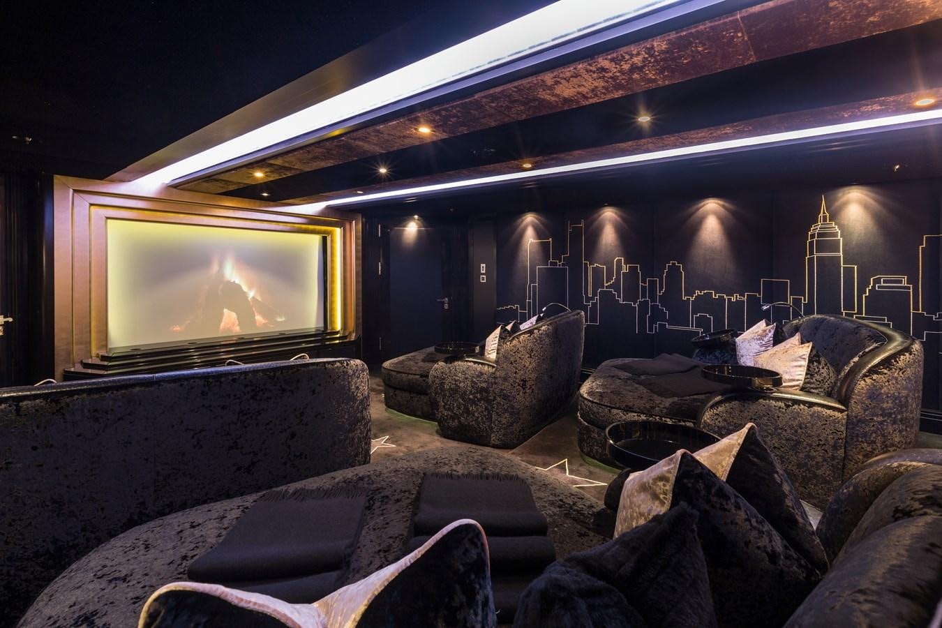 a room with couches and a fireplace aboard PHOENIX 2 Yacht for Sale