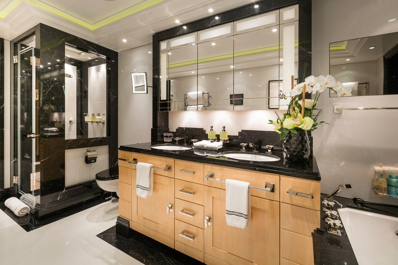 a kitchen with a glass shower aboard PHOENIX 2 Yacht for Sale