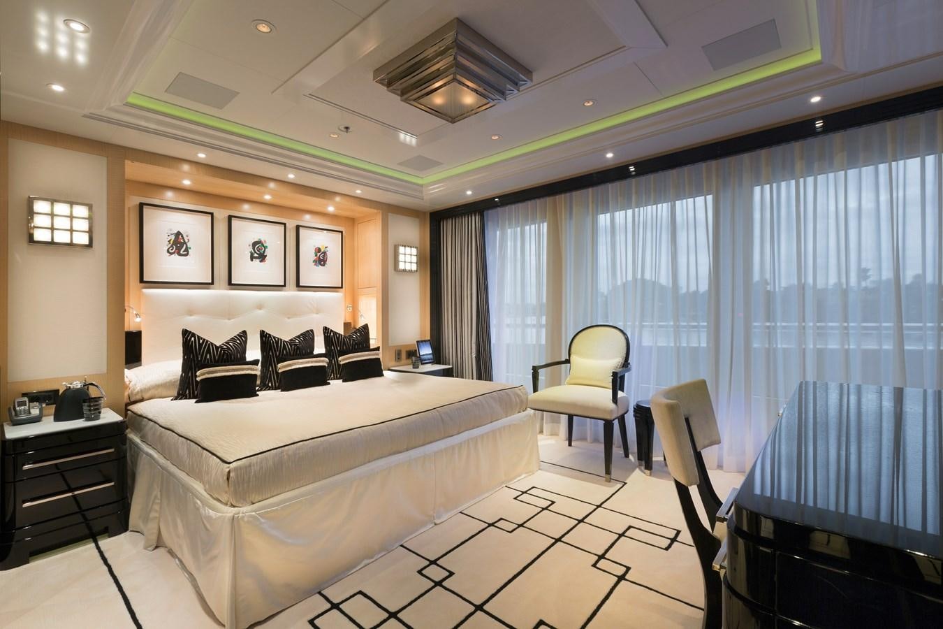 a bedroom with a large bed aboard PHOENIX 2 Yacht for Sale