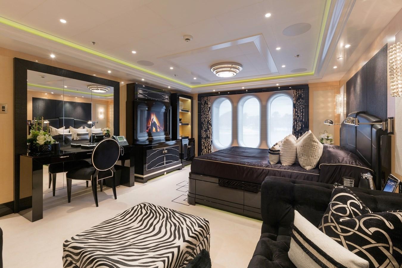 a living room with a leather couch aboard PHOENIX 2 Yacht for Sale