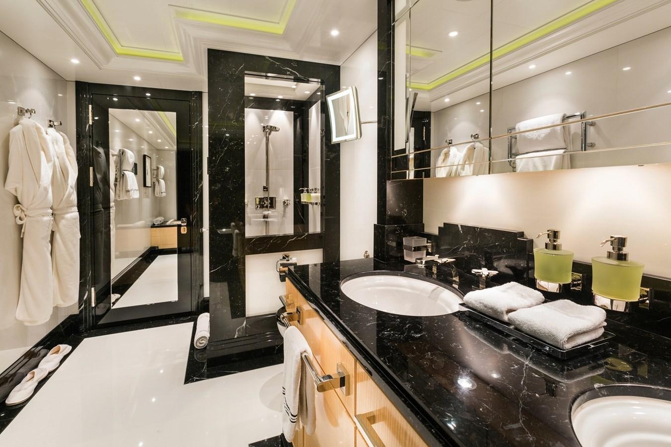 a bathroom with a large mirror aboard PHOENIX 2 Yacht for Sale
