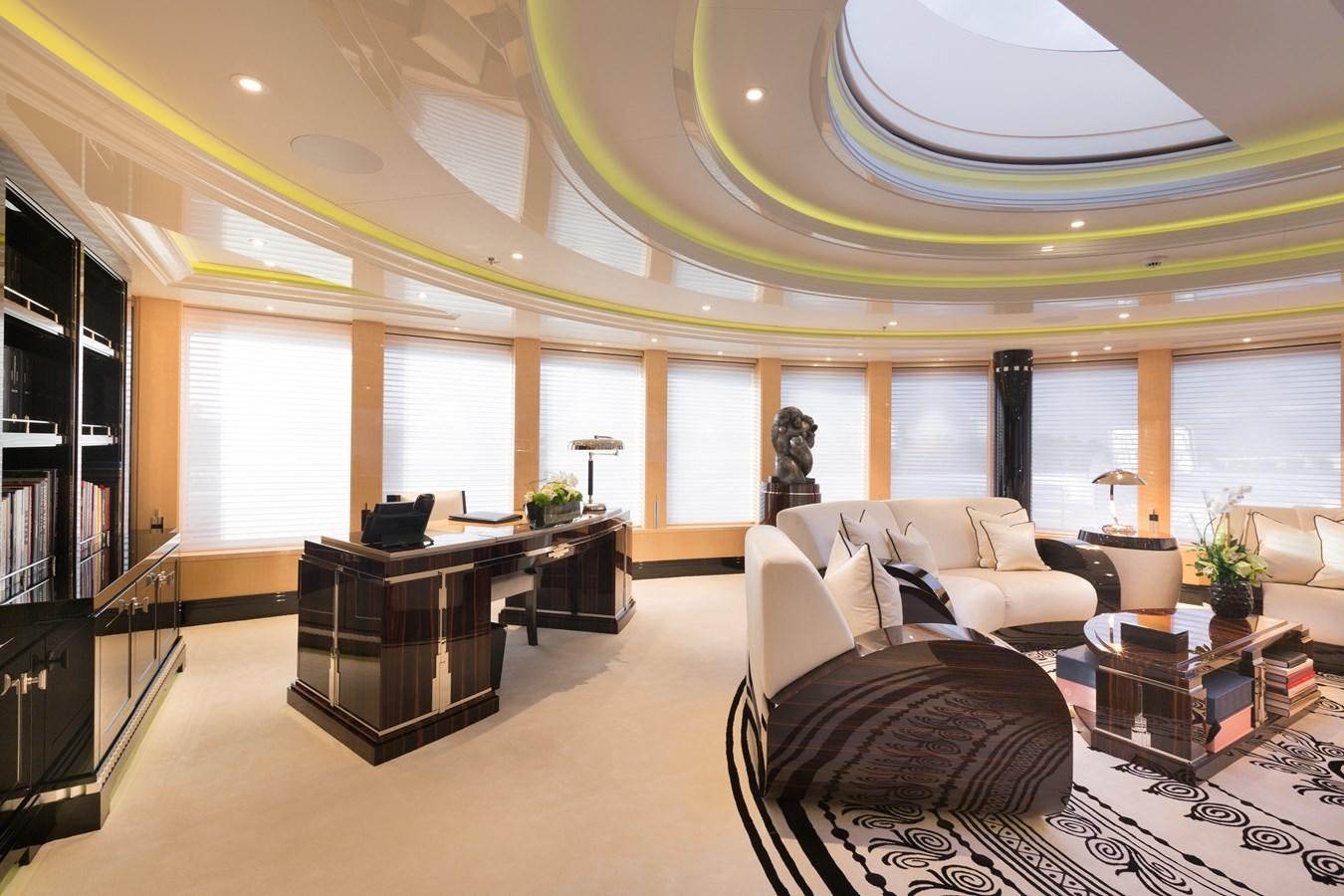 a large living room with a large window aboard PHOENIX 2 Yacht for Sale
