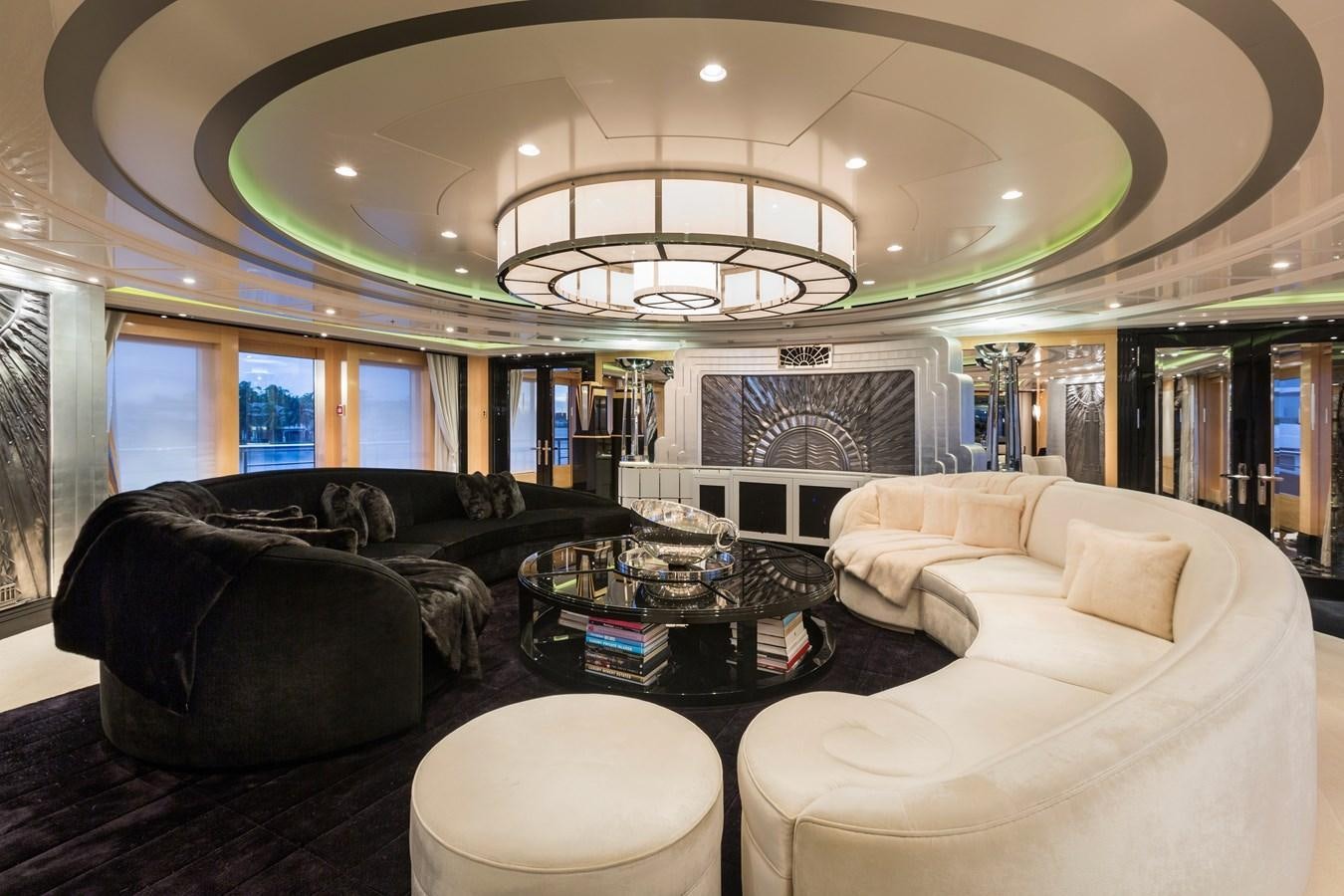 a living room with a chandelier aboard PHOENIX 2 Yacht for Sale