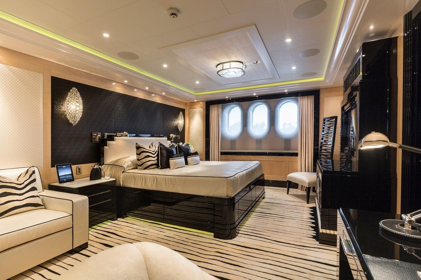 a room with a bed and a couch aboard PHOENIX 2 Yacht for Sale