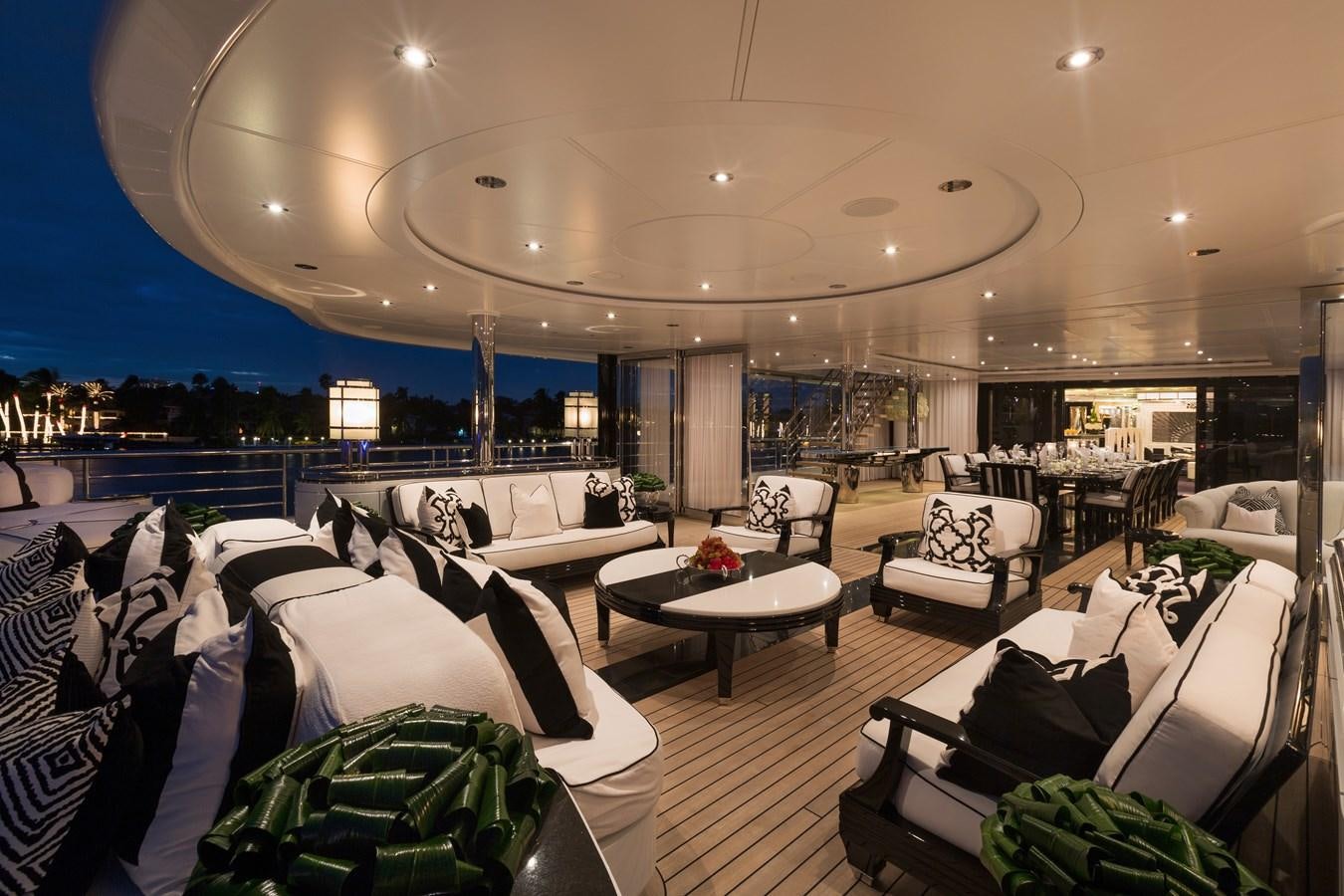 a large room with couches and a table aboard PHOENIX 2 Yacht for Sale