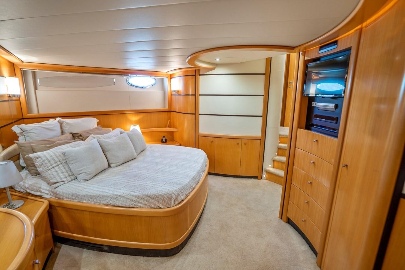 a bedroom with a bed and a closet aboard DENISE Yacht for Sale