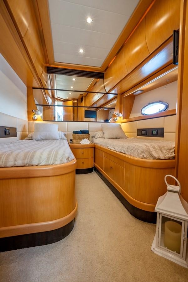 a room with a bed and a table aboard DENISE Yacht for Sale