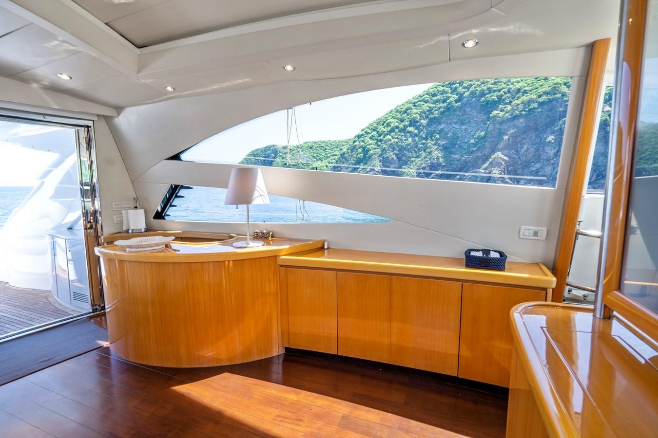 a room with a large window and a view of the ocean aboard DENISE Yacht for Sale