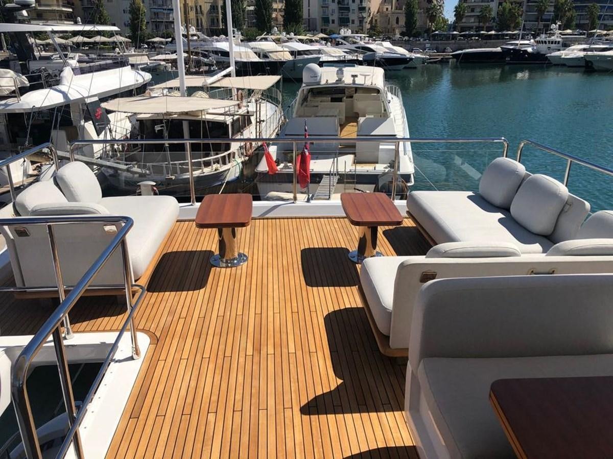 a deck with chairs and tables on it aboard GOLDINIA Yacht for Sale