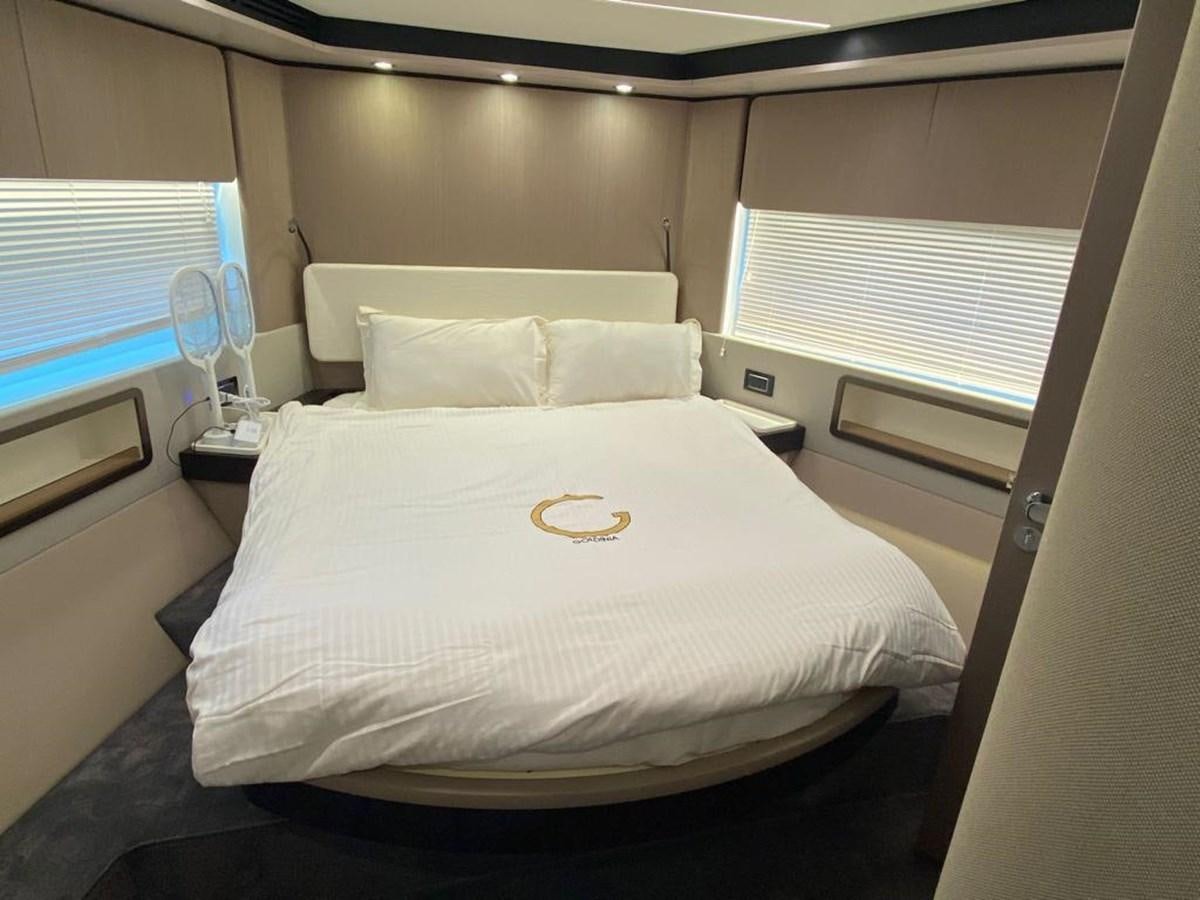 a bed with white sheets aboard GOLDINIA Yacht for Sale
