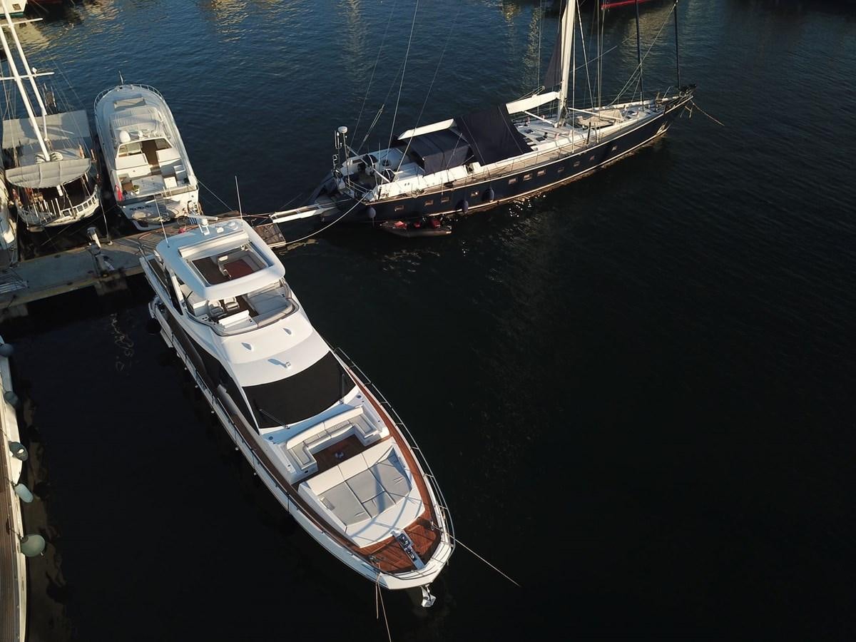 a group of boats in a harbor aboard GOLDINIA Yacht for Sale